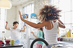 Young group of girl friends  dancing in kitchen wearing pyjamas