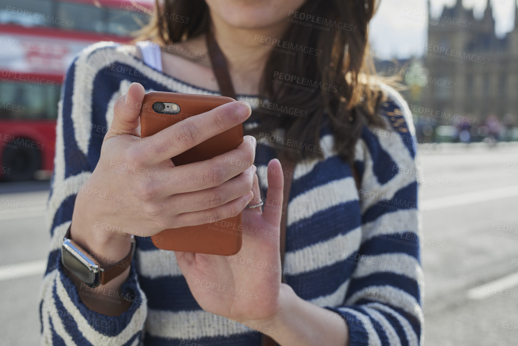 Buy stock photo Hands, woman and phone in city for travel with research, online location and bus schedule. Female person, mobile and reading for commute navigation, language translation and public transport for trip
