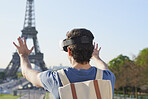 Futuristic traveler man experience vr headset virtual 3d augmented reality in Paris at Eiffel Tower concept