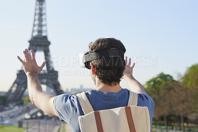 Buy stock photo Man, tourist and vr headset on travel at Eiffel Tower with metaverse view, backpack and hands up in summer. Person, outdoor and augmented reality for landmark, iot or bag on vacation at park in Paris