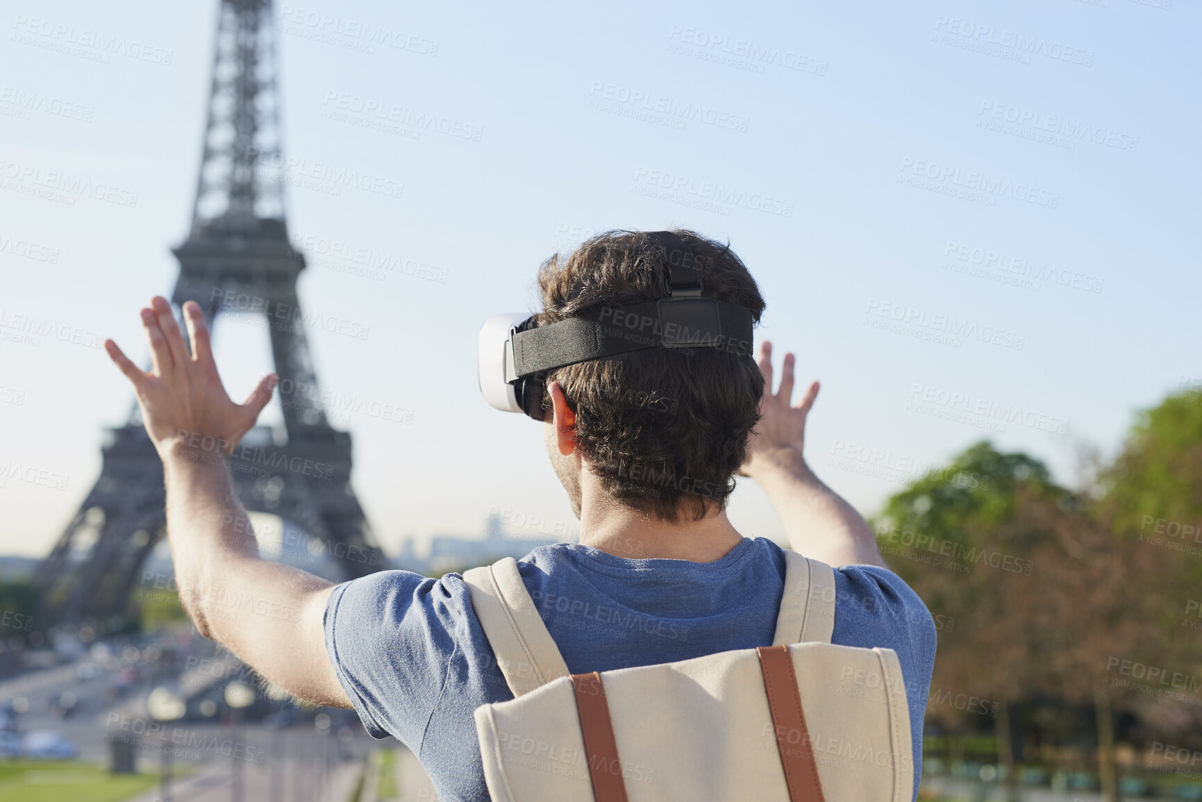 Buy stock photo Man, tourist and vr headset on travel at Eiffel Tower with metaverse view, backpack and hands up in summer. Person, outdoor and augmented reality for landmark, iot or bag on vacation at park in Paris