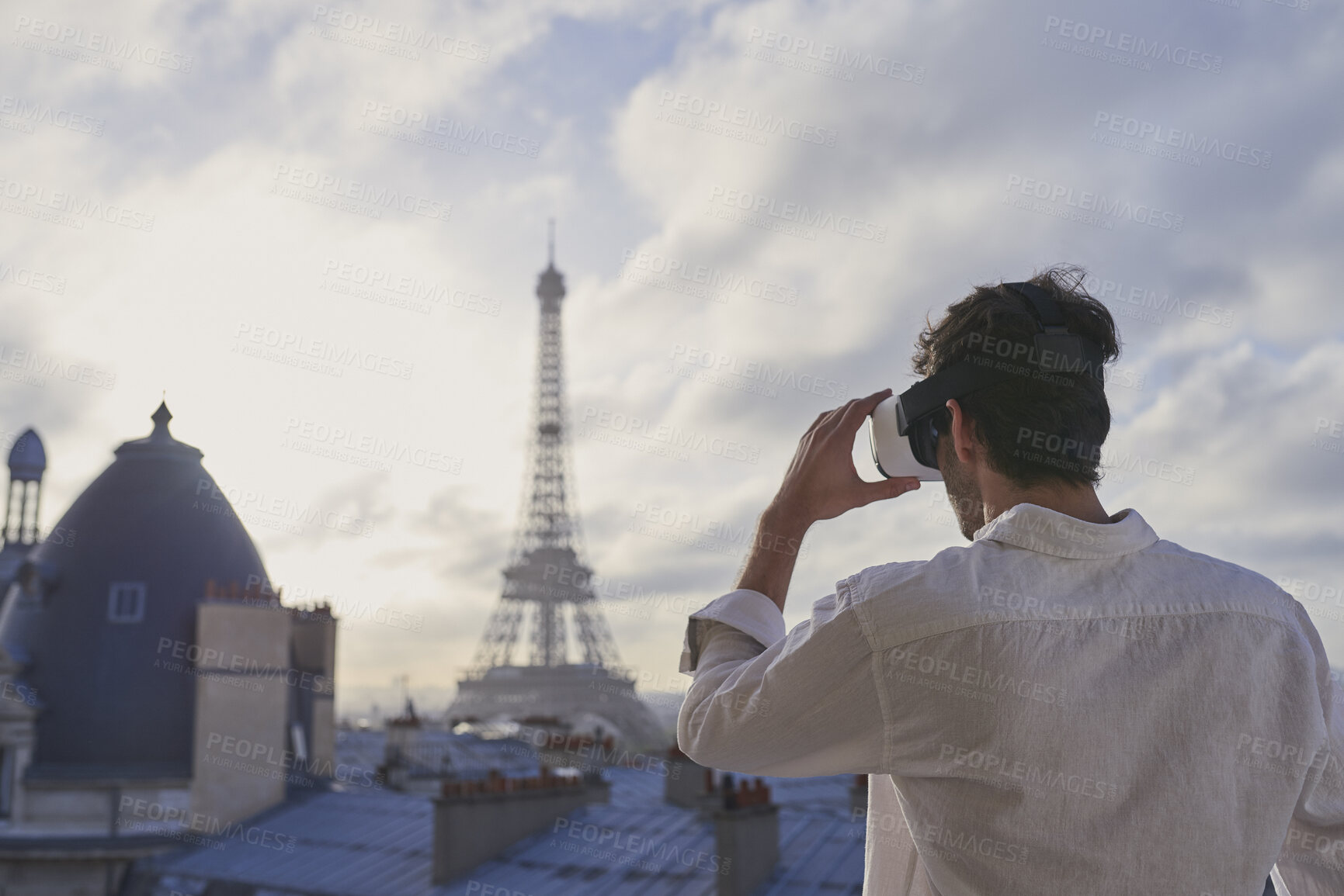 Buy stock photo Man, tourist and vr headset with view at Eiffel Tower in metaverse, balcony or travel in city with tech. Person, rooftop and augmented reality for landmark, iot and clouds in sky on vacation in Paris