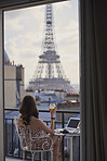 Travel woman enjoying view Eiffel Tower Paris hotel terrace breakfast destination vacation laptop camera