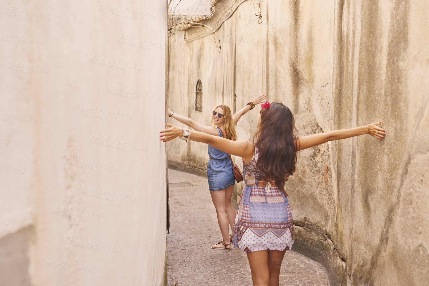 Buy stock photo Back, freedom and travel with women in old city for European break, holiday or vacation. Arms open, journey and walking with tourist friends outdoor in historical town to discover or explore culture