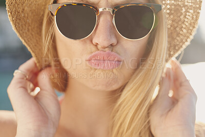 Buy stock photo Kiss, sunglasses and travel with woman outdoor for getaway, holiday or vacation in summer. Hat, shades and sunshine with person pouting at beach for coastal trip, weekend or wellness as tourist
