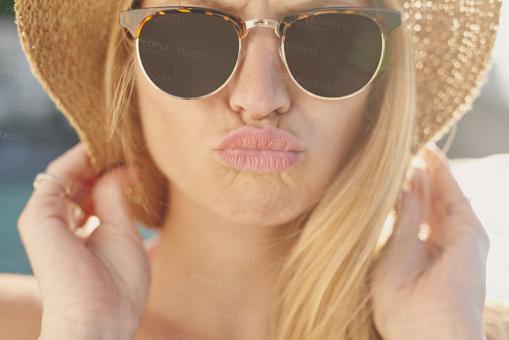 Buy stock photo Kiss, sunglasses and travel with woman outdoor for getaway, holiday or vacation in summer. Hat, shades and sunshine with person pouting at beach for coastal trip, weekend or wellness as tourist