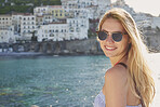 Portrait of Beautiful happy smiling tourist woman enjoying scenic view of Amalfi Coast on summer adventure vacation