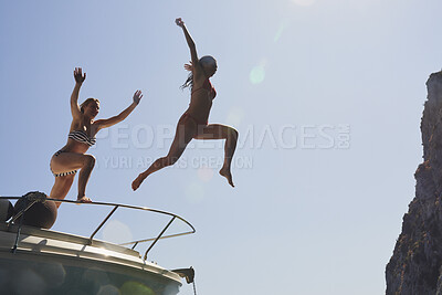Buy stock photo Boat, jump and girl friends outdoor for adventure on summer holiday, getaway or weekend trip. Energy, blue sky and women with fun on yacht for freedom with swimming on vacation together by space.