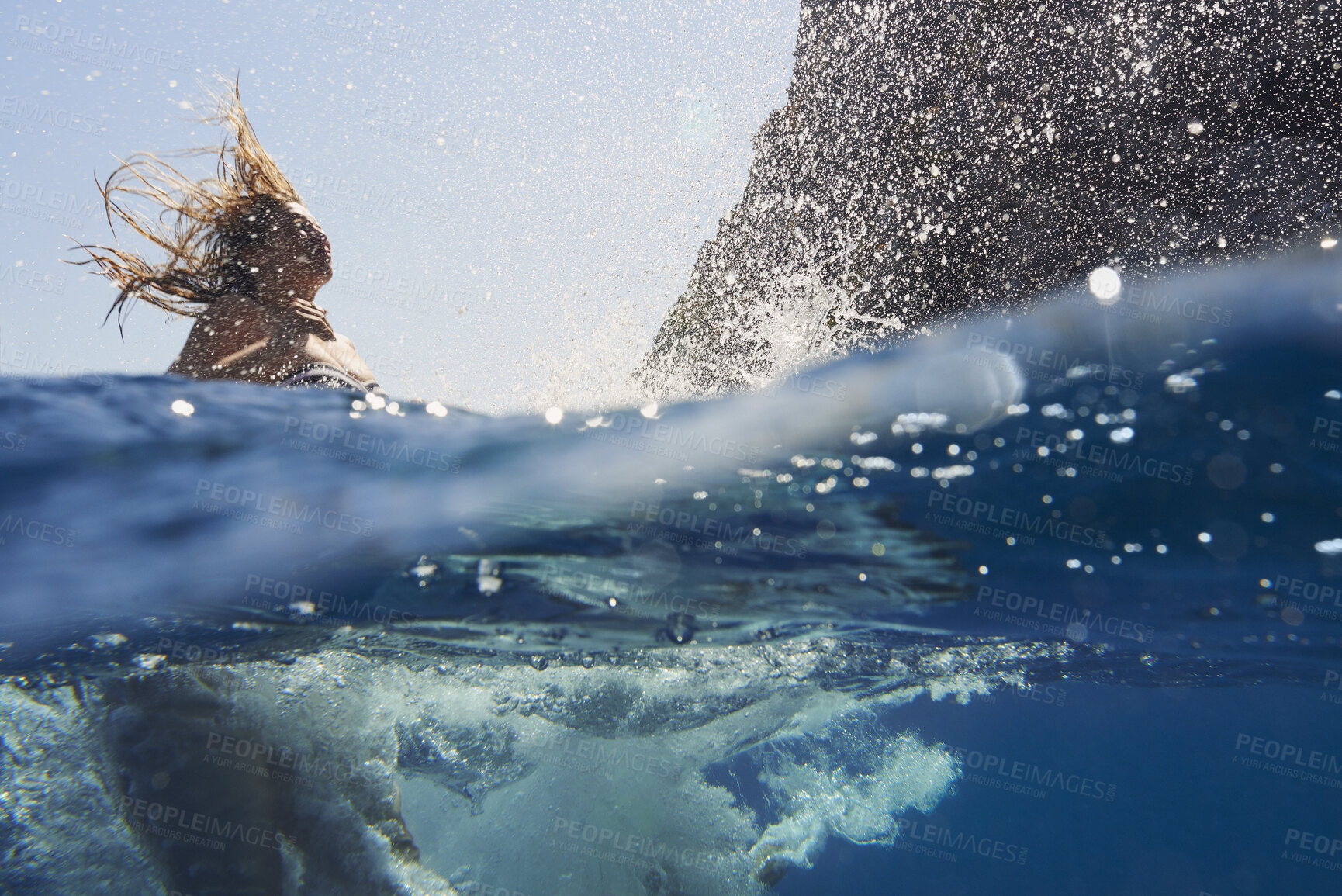 Buy stock photo Ocean, woman and diving for swimming with travel, splash and fun in nature on vacation abroad. Female swimmer, traveller and sea ripple with stress relief, trip or break with summer jumping in Italy