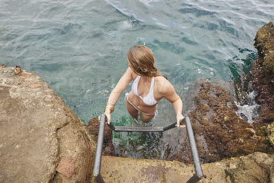 Buy stock photo Ladder, summer holiday and woman in ocean with swimming, tropical getaway or weekend break outdoor. Female person, steps and thinking in sea water with peaceful vacation, wellness and tourist travel.