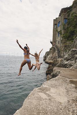 Buy stock photo Back, travel and friends jumping from cliff with adrenaline, adventure and holiday at ocean. Thrill, tourist and people on coastal ledge with freedom, sea water and tropical vacation for reunion trip