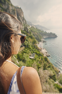 Buy stock photo Woman, travel and explore with back view by ocean, adventure and sightseeing with coastal city experience. Seaside, tourism and female person in nature, holiday or vacation with calm in Italy