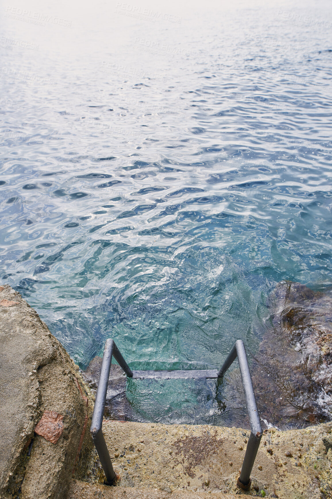 Buy stock photo Above, ladder and ocean with calm, fresh air or tranquil environment for holiday, trip and vacation. Access, ripples and sea water with outdoor background of nature for getaway, space or travel