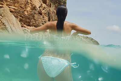 Buy stock photo Woman, swimming or ocean water with bikini for outdoor vacation, travel or summer holiday in nature. Back view, female person or swimmer in sea or swimsuit for tropical adventure or journey on island