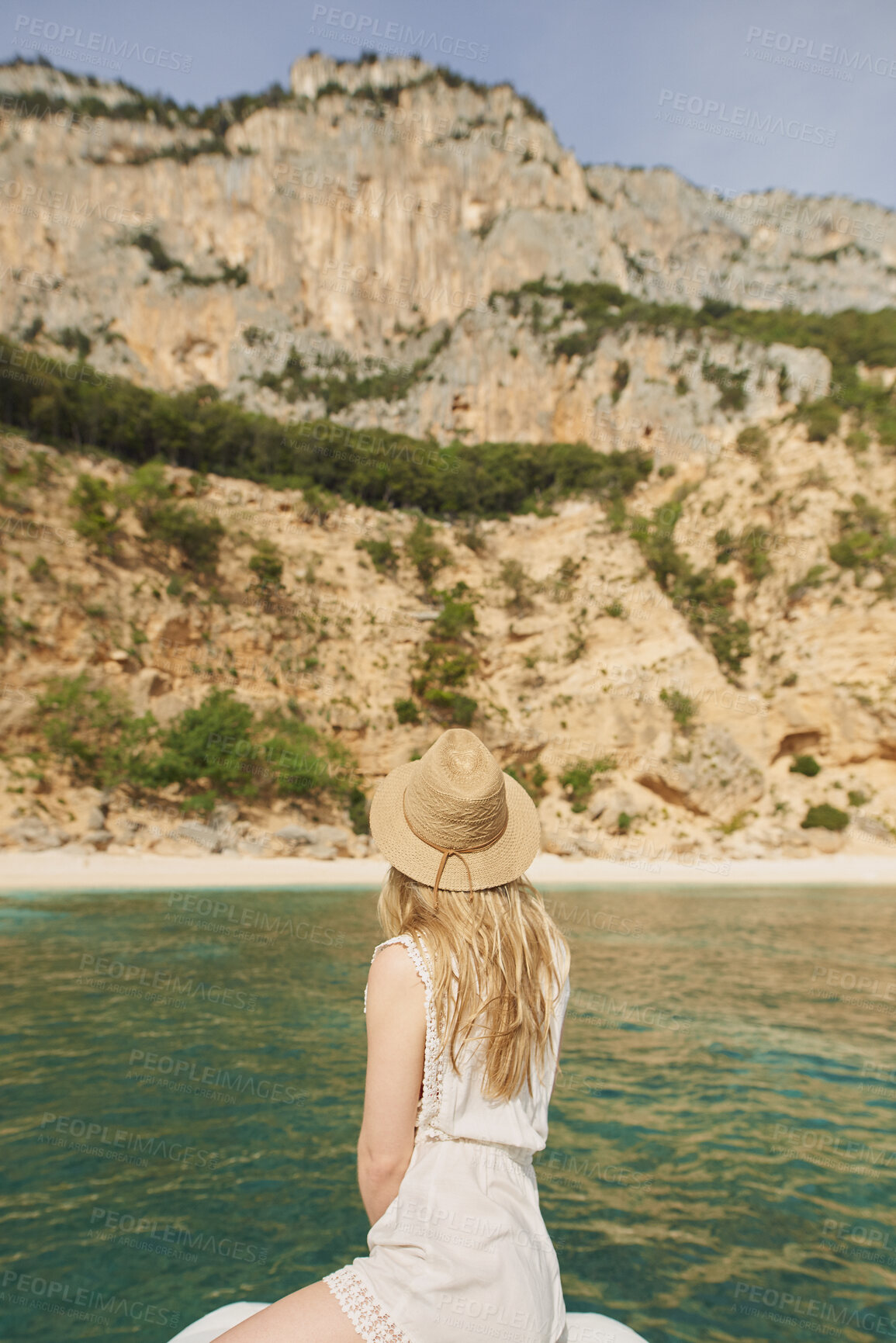 Buy stock photo Woman, travel and sea with hat in nature for summer vacation, journey or outdoor adventure. Back view, female person or traveler with natural scenery on boat, ocean water or beach for sightseeing