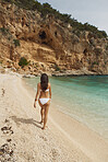 Beautiful woman in bikini on beach paradise enjoyment of healthy travel vacation
