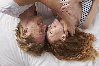 Buy stock photo Above, happy and couple with love in bedroom for peace, calm morning and partner affection. Smile, relax and people  on comfortable bed for weekend break, commitment and healthy relationship at house