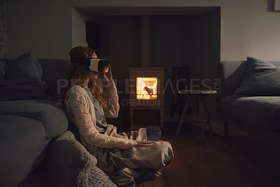 Buy stock photo Woman, home and relax with vr headset in lounge, virtual reality and chilling on floor with blanket. Futuristic, software and person with 3D goggles at night, cozy and watch immersive movie in house