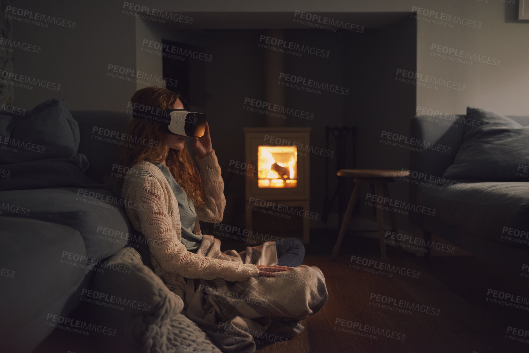 Buy stock photo Woman, home and relax with vr headset in lounge, virtual reality and chilling on floor with blanket. Futuristic, software and person with 3D goggles at night, cozy and watch immersive movie in house