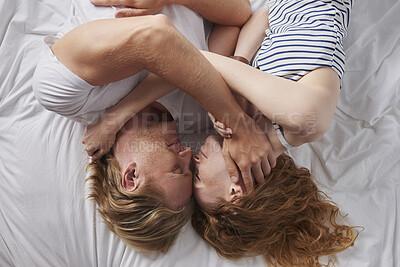 Buy stock photo Relax, love and couple with smile in bedroom for peace, calm morning and partner affection. Above, people and embrace with admiration for weekend break, commitment and healthy relationship at house