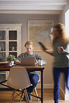 Attractive man woman couple using laptop digital tablet technology at home browsing internet network