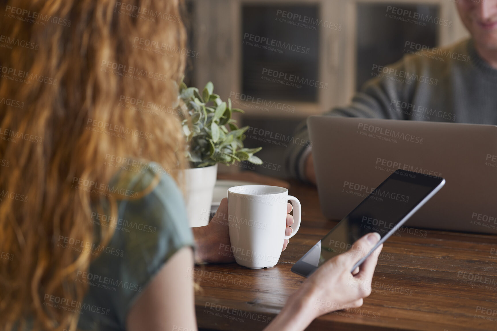 Buy stock photo Woman, hands and home with tablet screen or coffee for morning beverage, research or information. Female person, user or freelancer with mug or technology display for app, news or network in house
