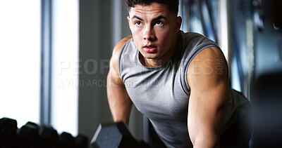 Buy stock photo Exercise, serious or man with dumbbell in gym, strength challenge or routine for muscle development. Fitness, bicep training or bodybuilder with weightlifting in sport club, strong or intense workout