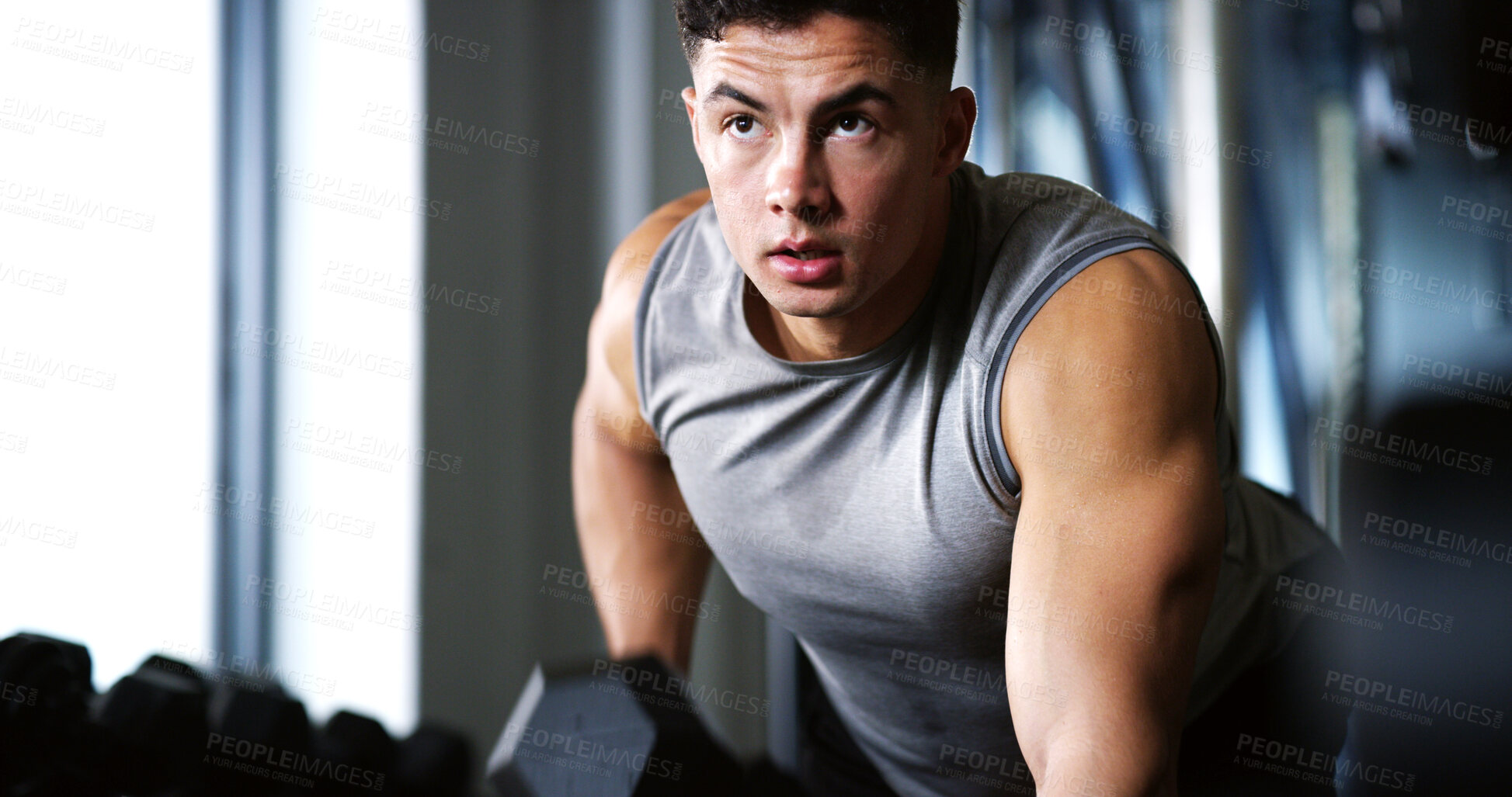 Buy stock photo Exercise, serious or man with dumbbell in gym, strength challenge or routine for muscle development. Fitness, bicep training or bodybuilder with weightlifting in sport club, strong or intense workout