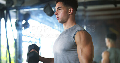 Buy stock photo Workout, serious or man with dumbbell in gym, strength challenge or routine for muscle development. Fitness, bicep training or bodybuilder with weightlifting in sport club, strong or intense exercise