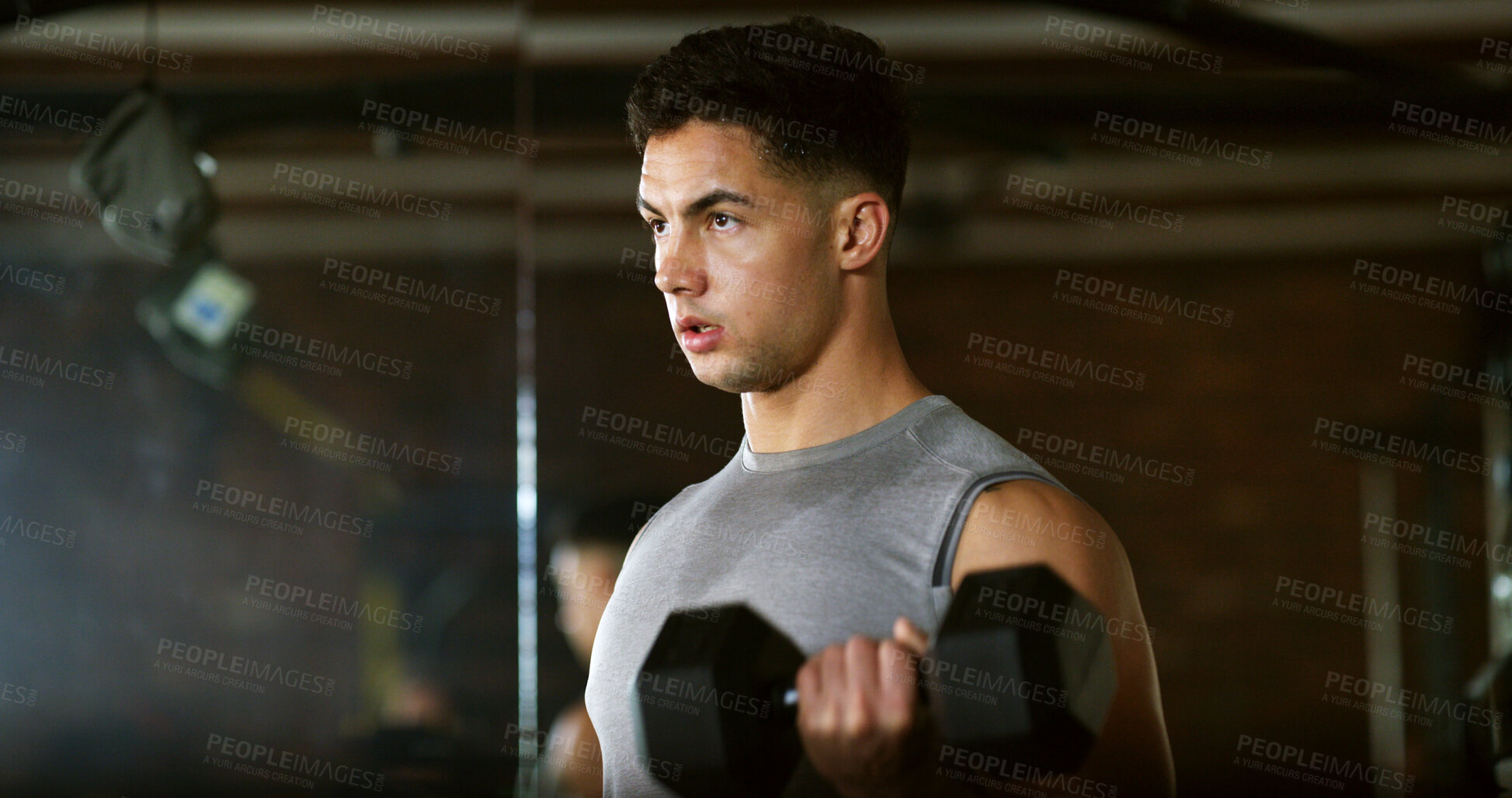 Buy stock photo Fitness, serious and man with weights in gym, strength challenge and routine for muscle development. Bodybuilding, bicep training and athlete with dumbbell in sports club, strong and intense exercise