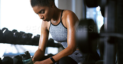 Buy stock photo Fitness, water and tired woman in gym, rest and thinking of intense training recovery for wellness. Hydration, sweat and African person with fatigue in exercise club, reflection or relax to cool down