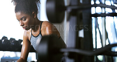Buy stock photo Fitness, exhausted and woman in gym, thinking or rest with intense training recovery for bodybuilder. Break, sweating and tired African person in exercise club for health, reflection and challenge