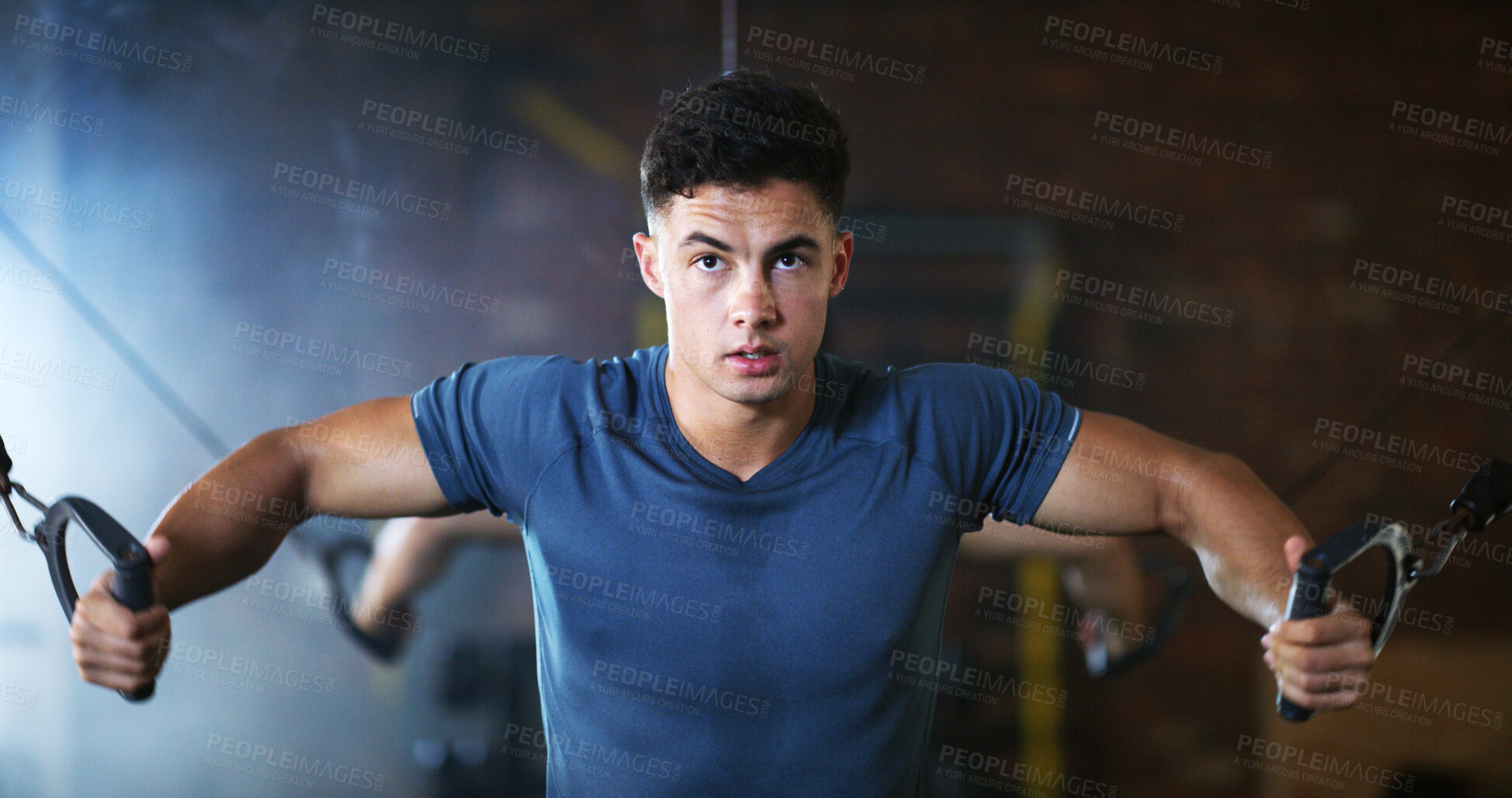 Buy stock photo Fitness, man and cable weight machine in gym, workout and resilience training for strength challenge. Sports club, equipment and athlete with anaerobic exercise for wellness, serious and muscle gain