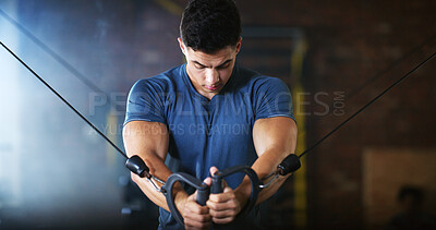 Buy stock photo Gym, fitness and man with cable machine for exercise routine, serious and training for muscle growth. Health club, bodybuilder and person with pulley equipment for workout, wellness and endurance