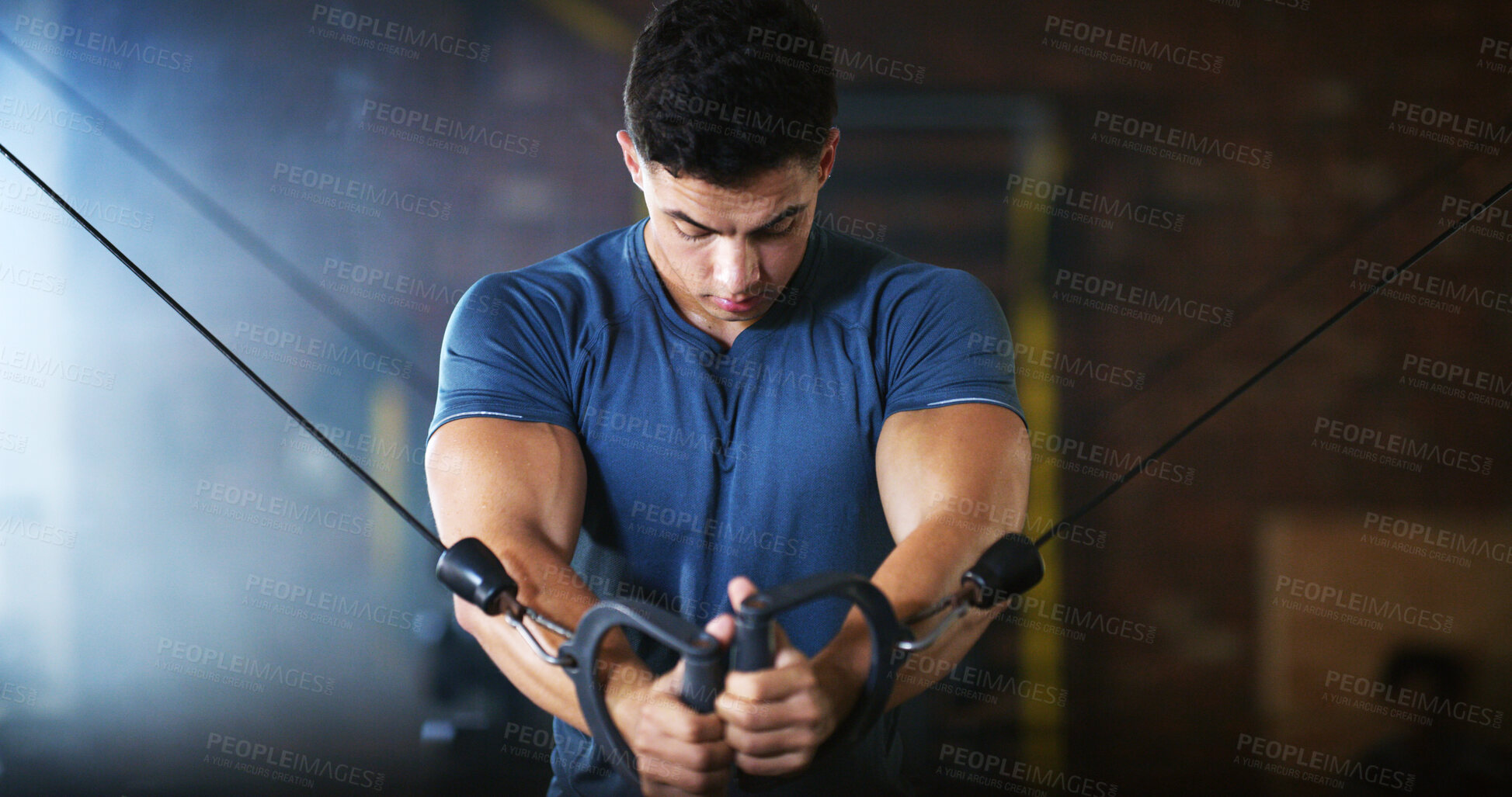 Buy stock photo Gym, fitness and man with cable machine for exercise routine, serious and training for muscle growth. Health club, bodybuilder and person with pulley equipment for workout, wellness and endurance