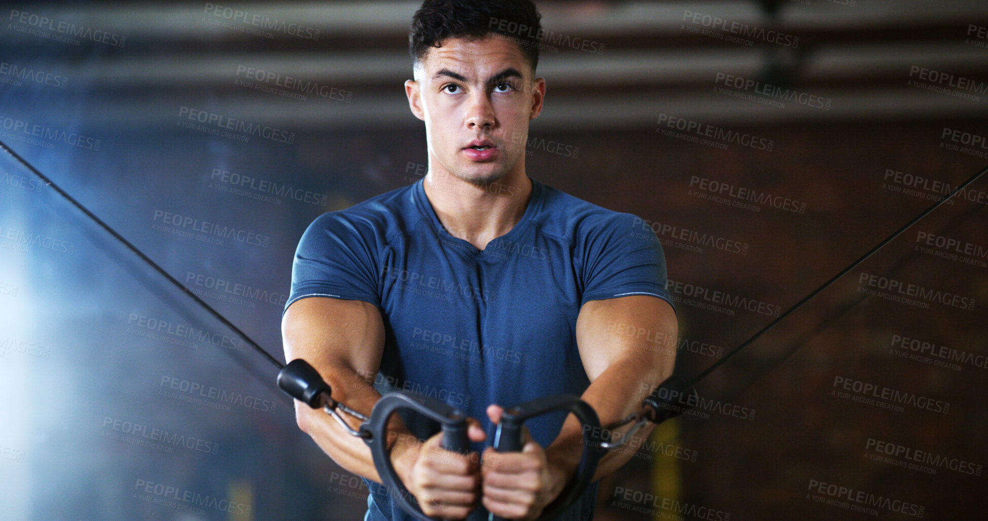 Buy stock photo Workout, man and cable weight machine in gym, fitness and resilience training for strength challenge. Sports club, equipment and athlete with anaerobic exercise for wellness, serious and muscle gain