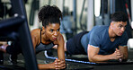 Woman, people and plank in gym with exercise, strength training and control breathing for wellness. Serious, person and balance on floor with stability, fitness challenge and workout class for abs.