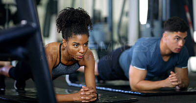 Buy stock photo Woman, people and plank in gym with exercise, strength training and control breathing for wellness. Serious, person and balance on floor with stability, fitness challenge and workout class for abs.