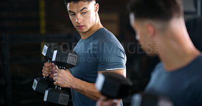 Buy stock photo Exercise, mirror and weightlifting with man in gym for routine, strength training or workout. Dumbbells, fitness and reflection with person in health club for activity, challenge or progress