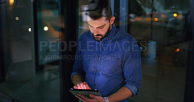 Buy stock photo Tablet, night and business man in office for compliance email, research or development project. Tech, reading and person in workplace on deadline, review policy or regulation report by window