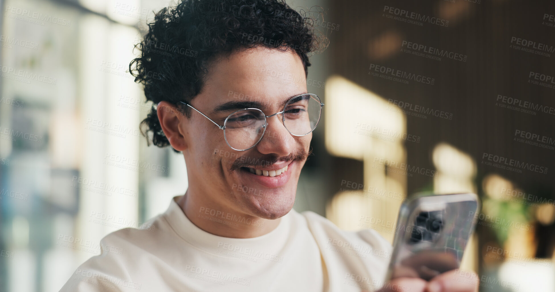 Buy stock photo Creative, man and happy with phone in office for email notification, good news or campaign approval. Digital marketer, person or smile with mobile app for positive review, monitor ads or text message