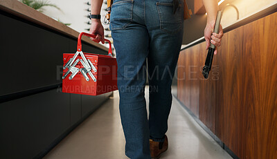 Buy stock photo Plumber, man and hands in kitchen with toolbox for maintenance, repair or skills for renovation project. Handyman, person and back of technician in home with small business, plumbing service and walk