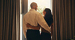 Travel, open curtain and couple in hotel with thinking, bonding and connection at arrival on holiday. Happy, window and man hugging woman at resort for vacation with love, care and commitment.

