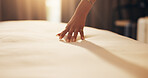 Hands, woman and touch bedsheet in hotel room for fabric quality, check cleanliness and holiday. Guest, person and duvet inspection at lodge for comfort, hygiene standard and weekend getaway on space