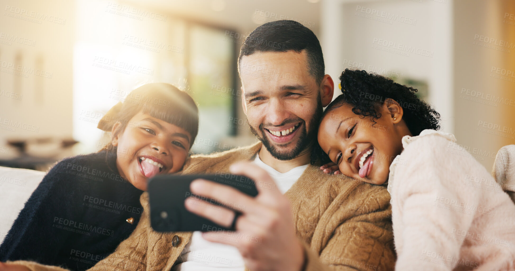 Buy stock photo Father, children and tongue out in home with selfie, bonding together and social media post on weekend. Dad, girl kids and funny face in living room with photography, memories and family connection.