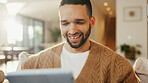 Tablet, relax and happy man in living room for reading ebook, online search and entertainment. Tech, smile and person at home for social media profile, browsing internet or news with daily update