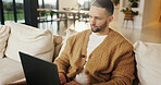 Freelancer, laptop and man in home for research, digital marketing or reading email in living room. Computer, remote work and person on sofa for campaign project, brand proposal and review ads