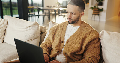 Buy stock photo Freelancer, laptop and man in home for research, digital marketing or reading email in living room. Computer, remote work and person on sofa for campaign project, brand proposal and review ads