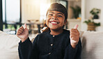 Portrait, child and smile in living room with thumbs up, goal and milestone for childhood development. Happy, young girl and hand gesture in home with like emoji, achievement and success for growth.