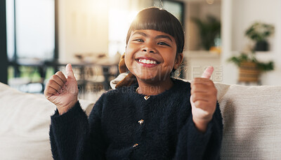 Buy stock photo Portrait, child and smile in living room with thumbs up, goal and milestone for childhood development. Happy, young girl and hand gesture in home with like emoji, achievement and success for growth.